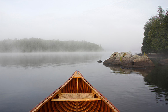 Bow of a Cedar Canoe on a Misty Lake