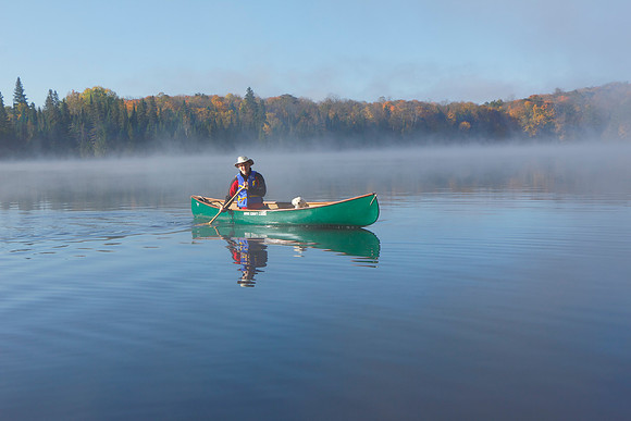 Canoeist on an Autumn Lake