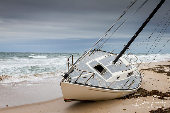 Sailboat Grounded on a Florida Beach