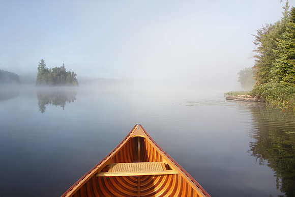 Canoeing on a Misty Lake