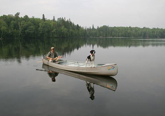 Canoeist with Springer Spaniel Navigating