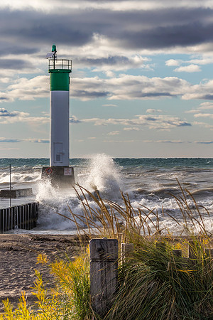 Lighthouse and pier on Lake Huron under a stormy sky - Ontario,
