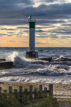 Lighthouse and pier on Lake Huron under a stormy sky - Ontario,