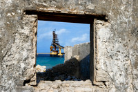 Salt Pier viewed through the window of an abandoned building - B