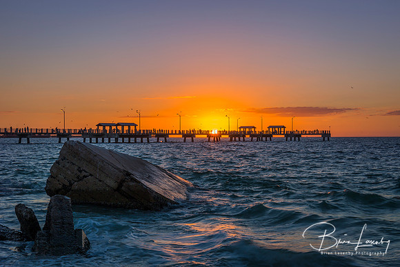 Rocks and fishing pier at sunset - St. Petersburg, Florida