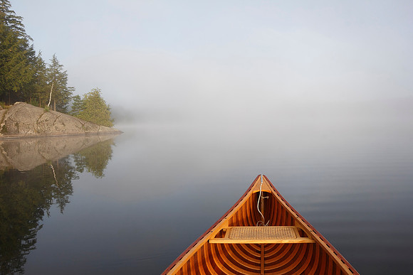 Canoeing on a Misty Lake